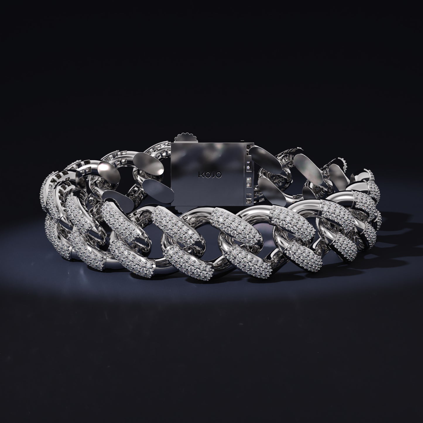 Silver chain bracelet on a black background with 'Kool' branding.
