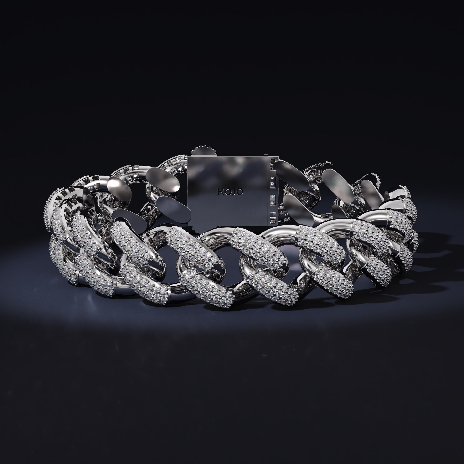 Silver chain bracelet on a black background with 'Kool' branding.