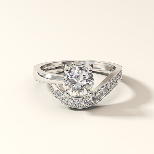 Round brilliant lab-grown diamond pavé engagement ring with curved band in 18K white gold.