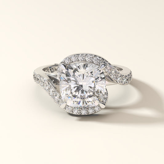 Cushion-cut lab-grown diamond halo engagement ring in 18K white gold.