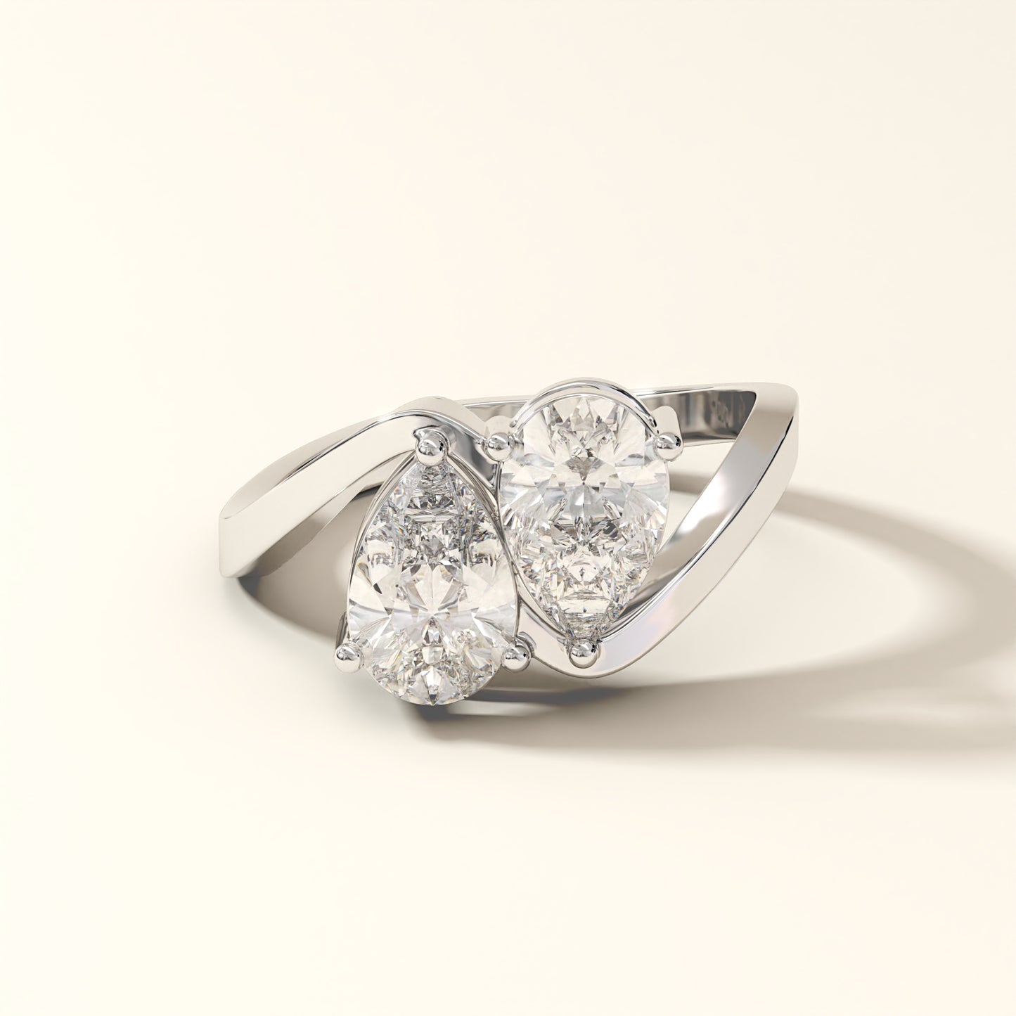 Twin Gleam 3 Carat Pear Cut Diamond Ring from KOJO Diamonds on a light beige background.