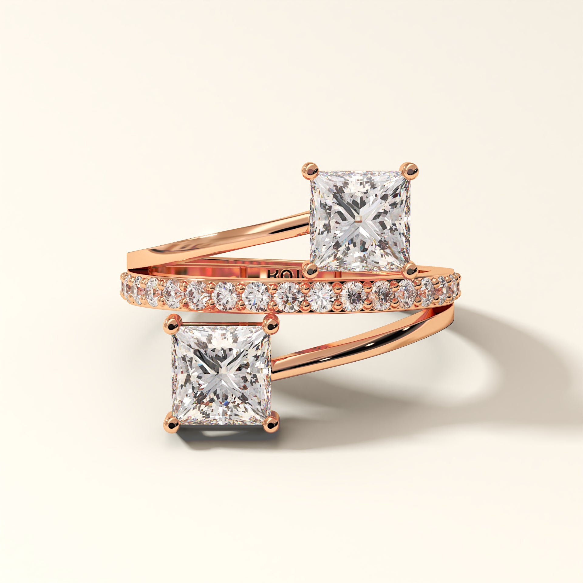 Prism Arc - 2 Princess Cut Diamond Ring with 17 Round Pavé Diamonds in 18K Rose Gold. Total diamond 2.36 Carat with princess-cut stones on a light background with "KOJO" branding.