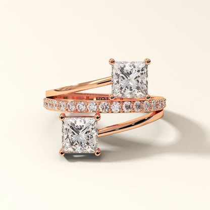 Prism Arc - 2 Princess Cut Diamond Ring with 17 Round Pavé Diamonds in 18K Rose Gold. Total diamond 2.36 Carat with princess-cut stones on a light background with "KOJO" branding.