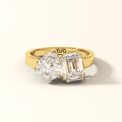 Duet Line - 3 Carat Emerald-cut diamond and Pear-cut Diamond Ring in 18K Yellow Gold with 'KOJO' branding on a light background.