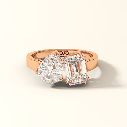 Duet Line - 3 Carat Emerald-cut diamond and Pear-cut Lab-Grown Diamond Ring in 18K Rose Gold with 'KOJO' branding on a light beige background.