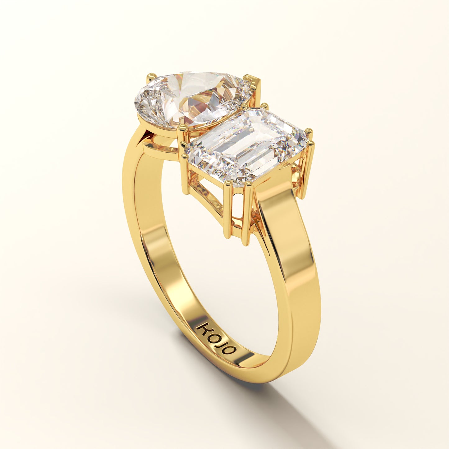 18K Yellow Gold ring with two diamonds on a white background (side view).