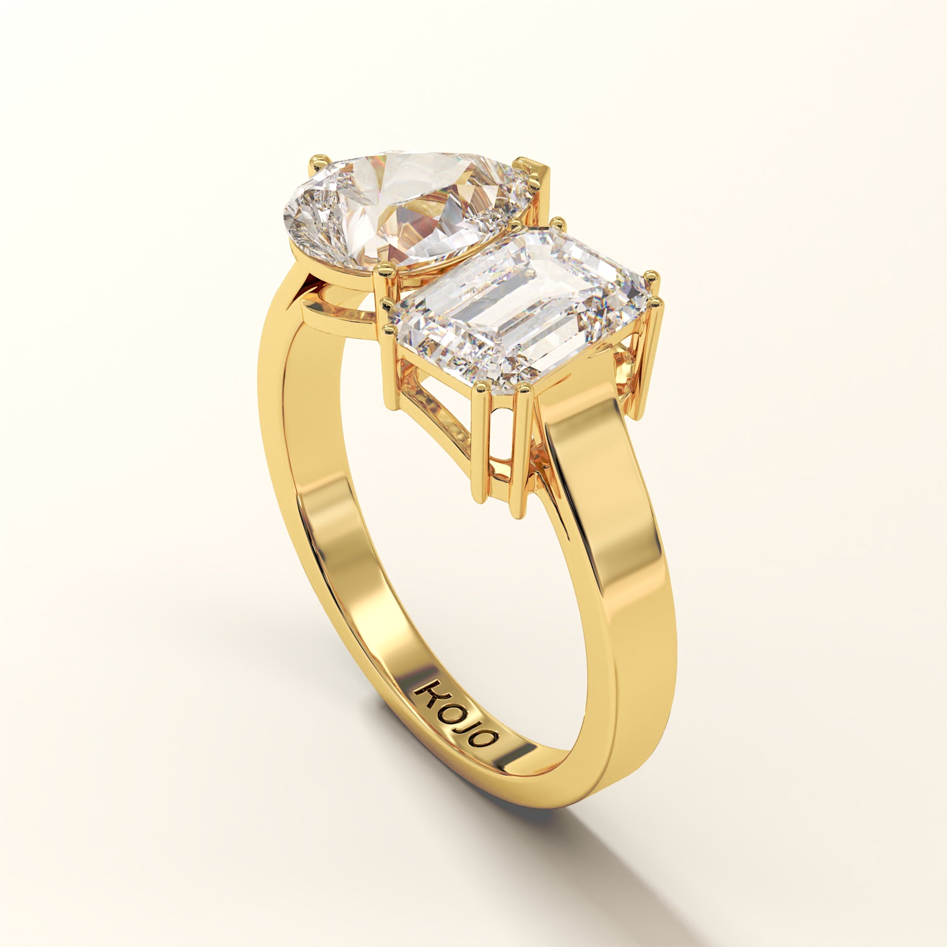 18K Yellow Gold ring with two diamonds on a white background (side view).