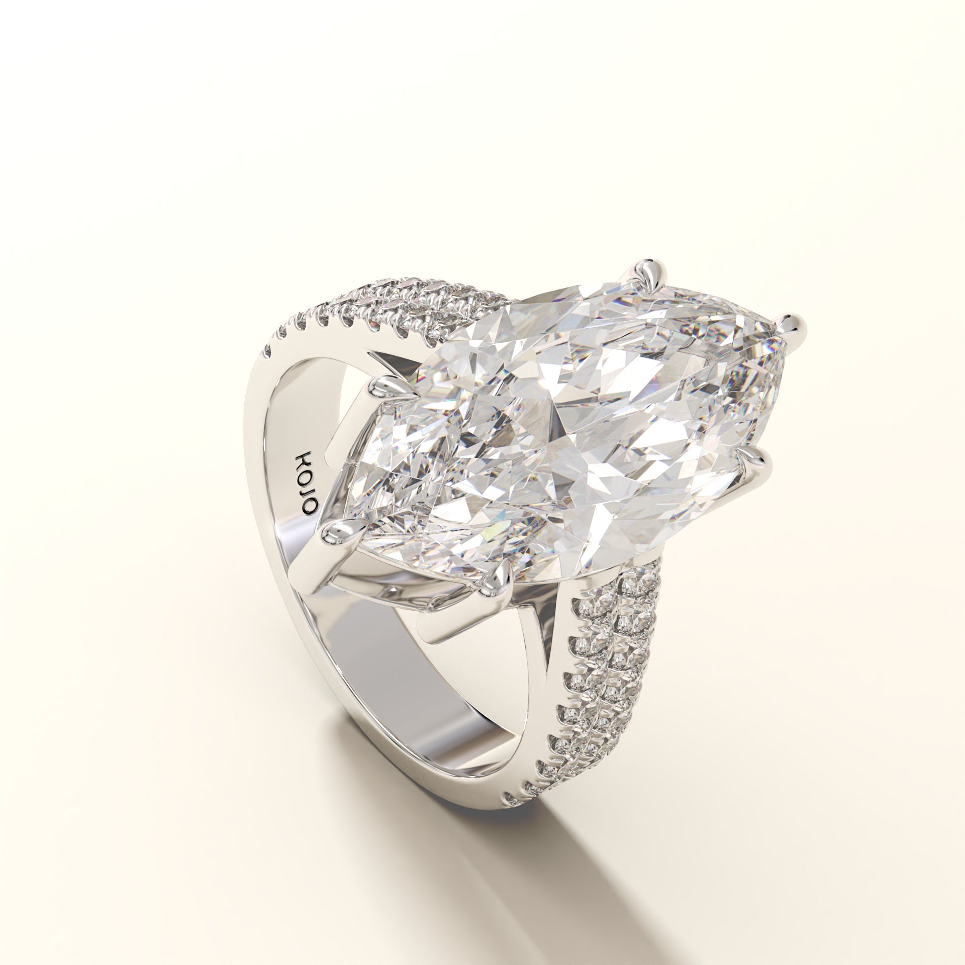 Diamond ring with a large central gemstone and smaller stones on a white background