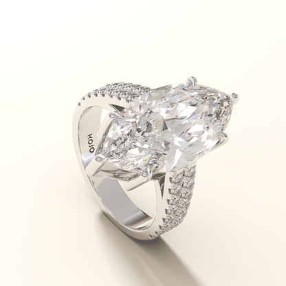 Diamond ring with a large central gemstone and smaller stones on a white background