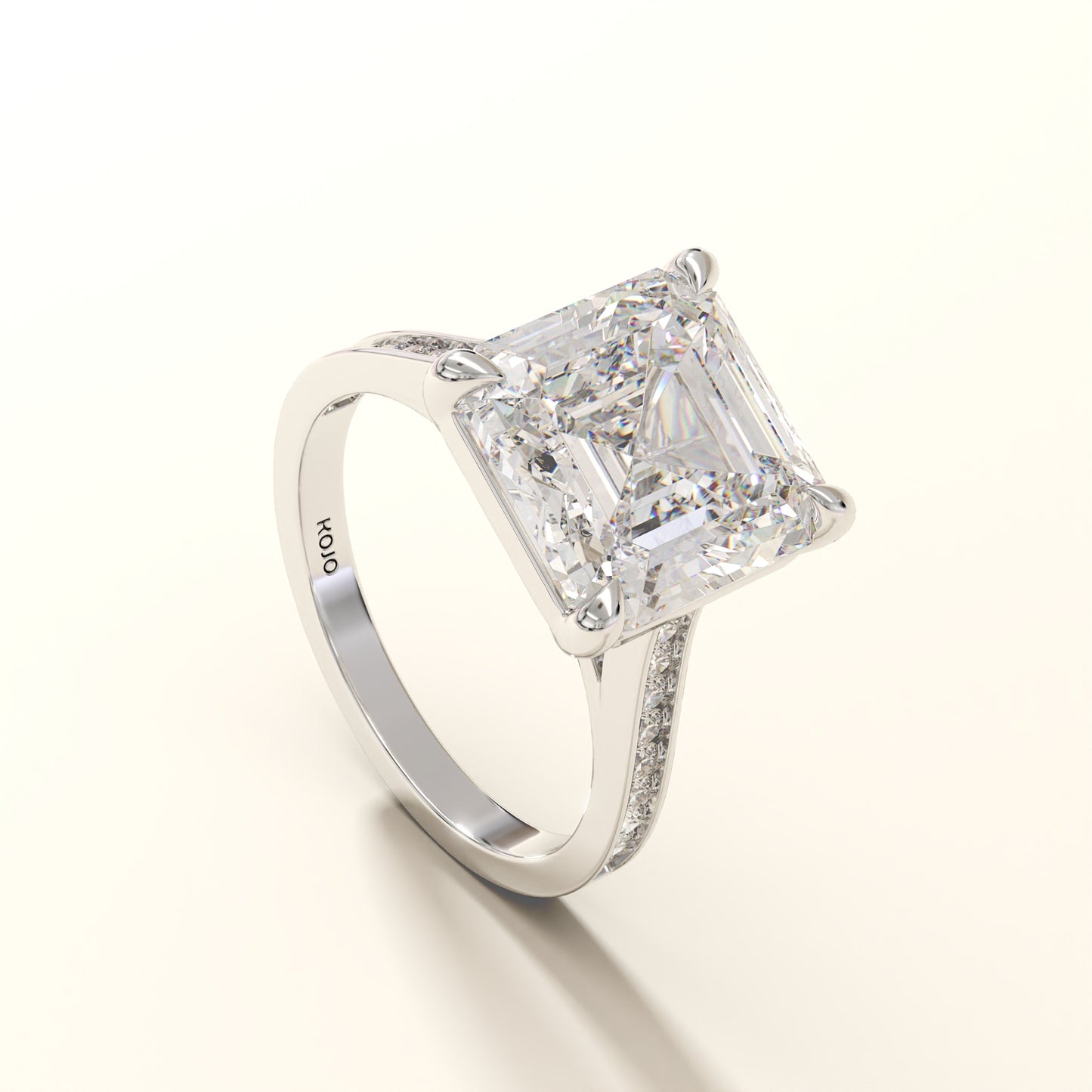 Diamond ring with a large asscher diamond and smaller round diamonds on the band 