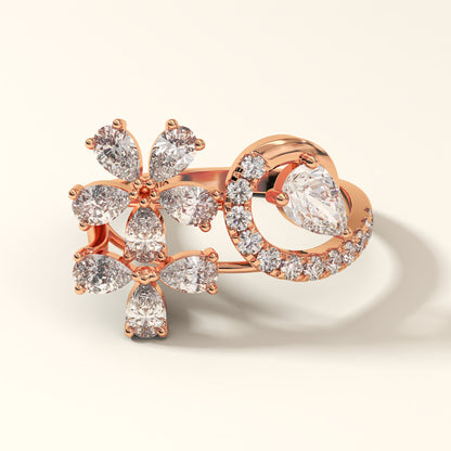 A rose gold floral design 2.13 Carat Pear Cut Diamond Ring with 8 Pear-Cut Diamonds, 1 Pear-Cut Diamond and 12 Pavé Round Diamonds in 18K rose gold. Celestine Flora Rose gold ring with diamond accents on a light beige background (front-view).