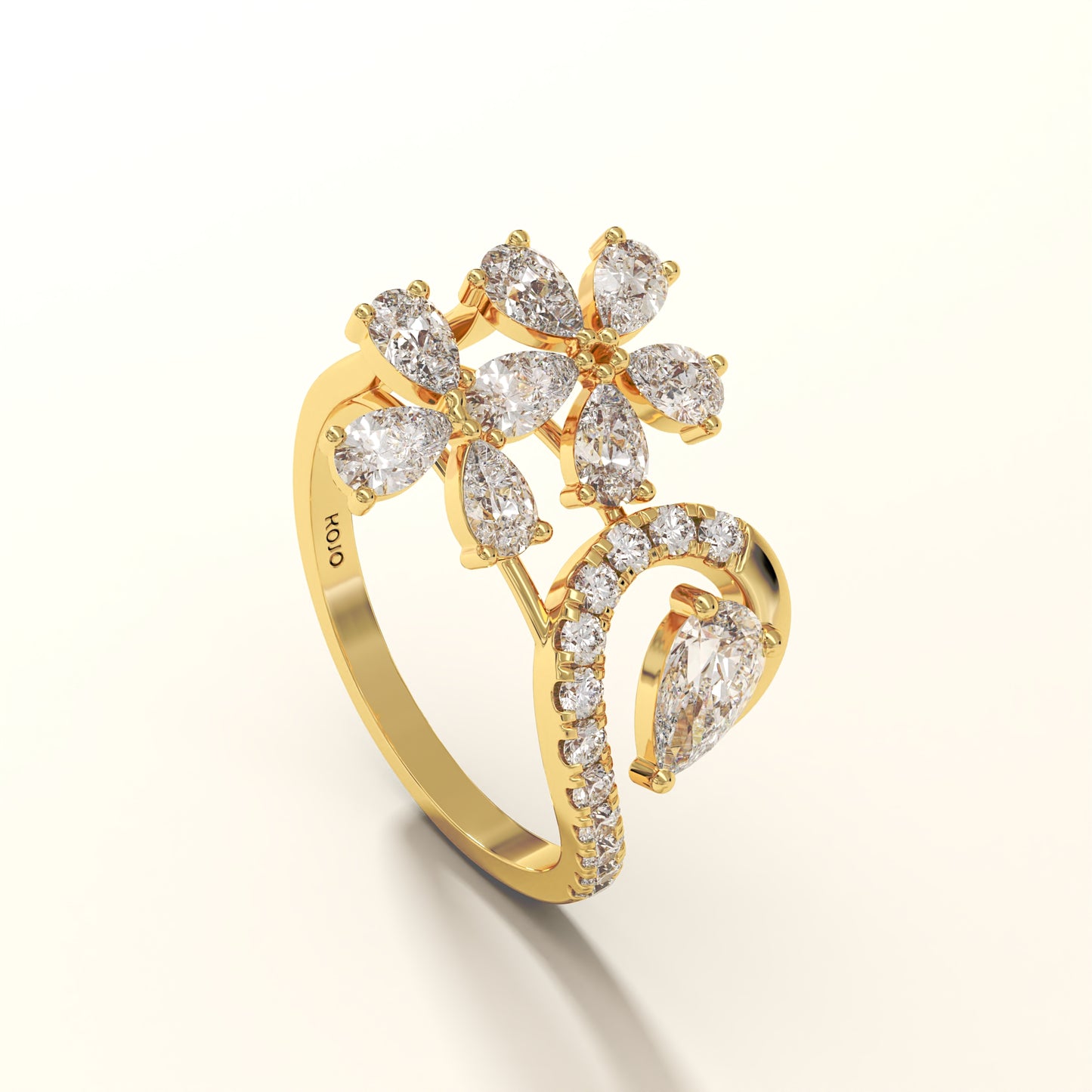 Gold ring with diamond flowers on a white background