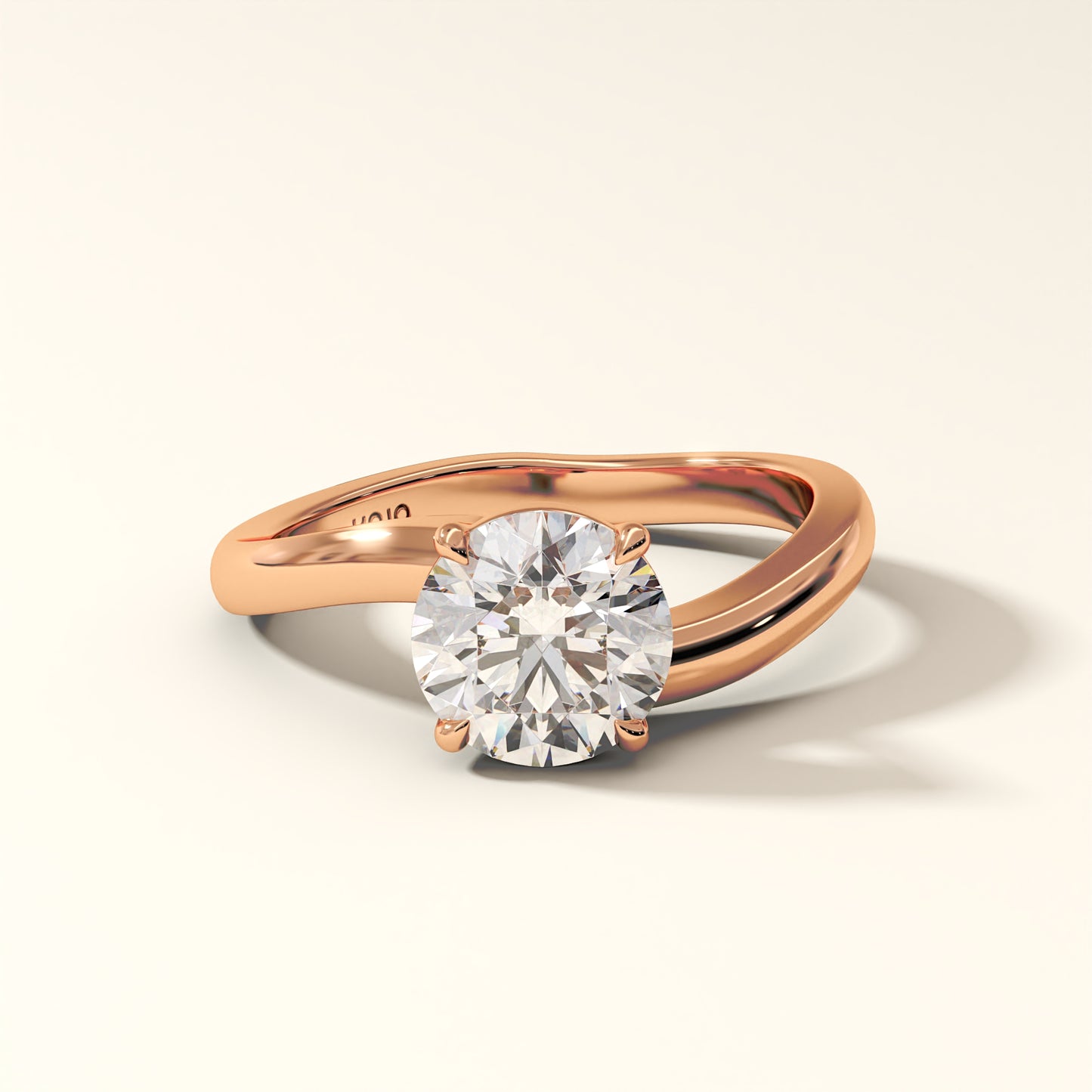 1.50 Carat Round Brilliant Diamond Ring in Rose gold with "KOJO" Diamonds branding on a light beige background. The Solara Arc Diamond Ring displayed with front-view.