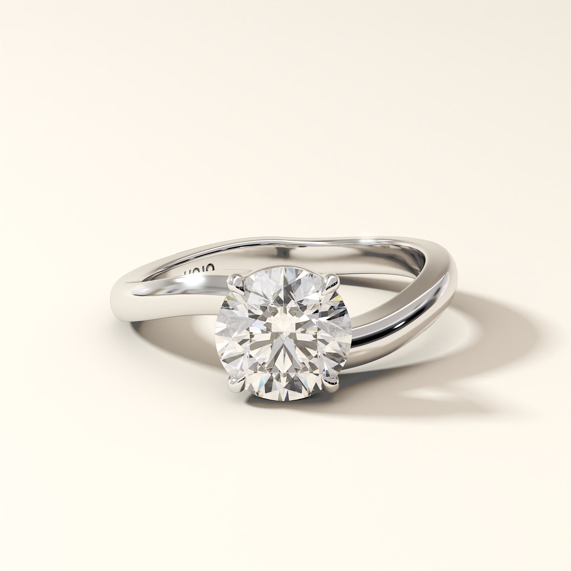 Solara Arc - 1.50 Carat Round Brilliant Diamond Ring in white gold with "KOJO" Diamonds branding on a light beige background (front view).