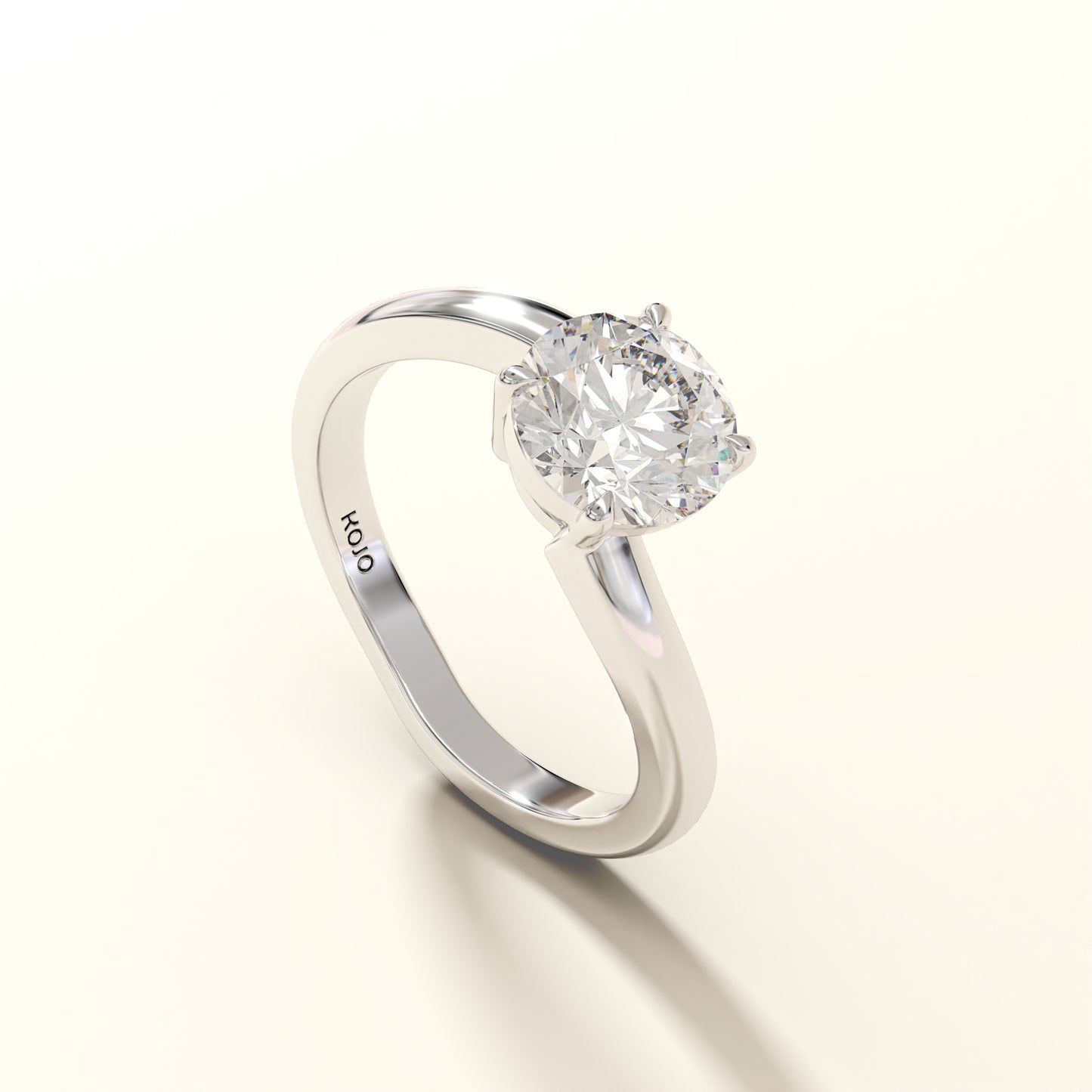 1.50 Carat Round Diamond ring with 'Kojo' branding on a white background (side-view).