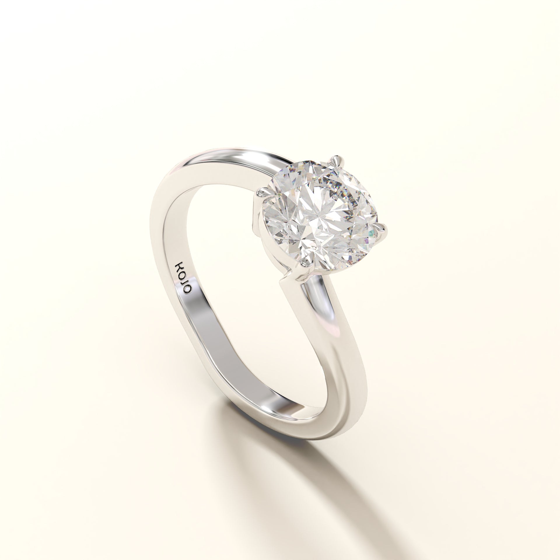 1.50 Carat Round Diamond ring with 'Kojo' branding on a white background (side-view).