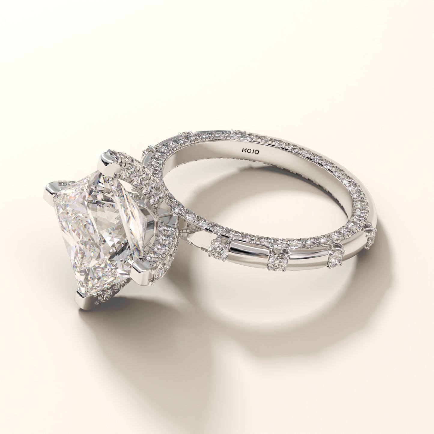 Princess-cut with round brilliant lab grown diamond ring in white gold on a light background