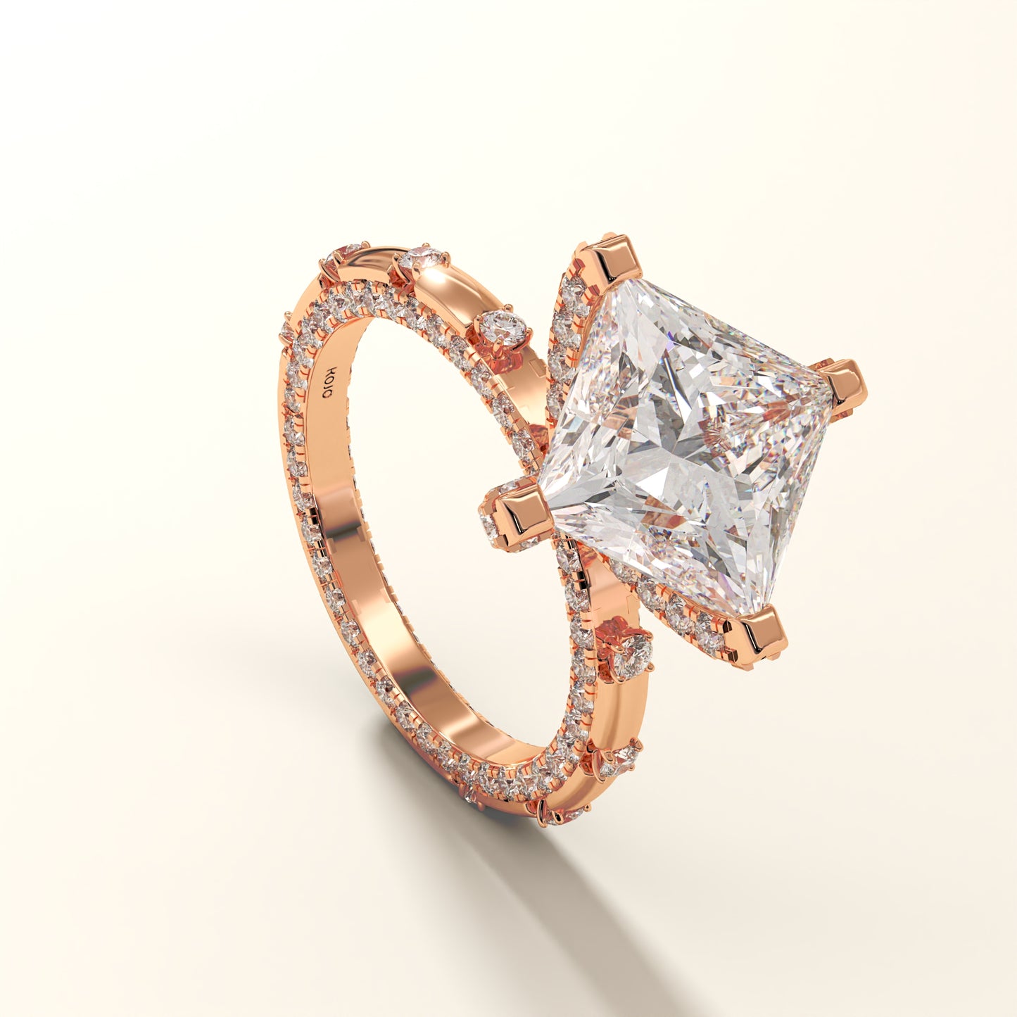 A Princess-cut lab grown diamond ring in 18kt Rose gold on a light yellow background