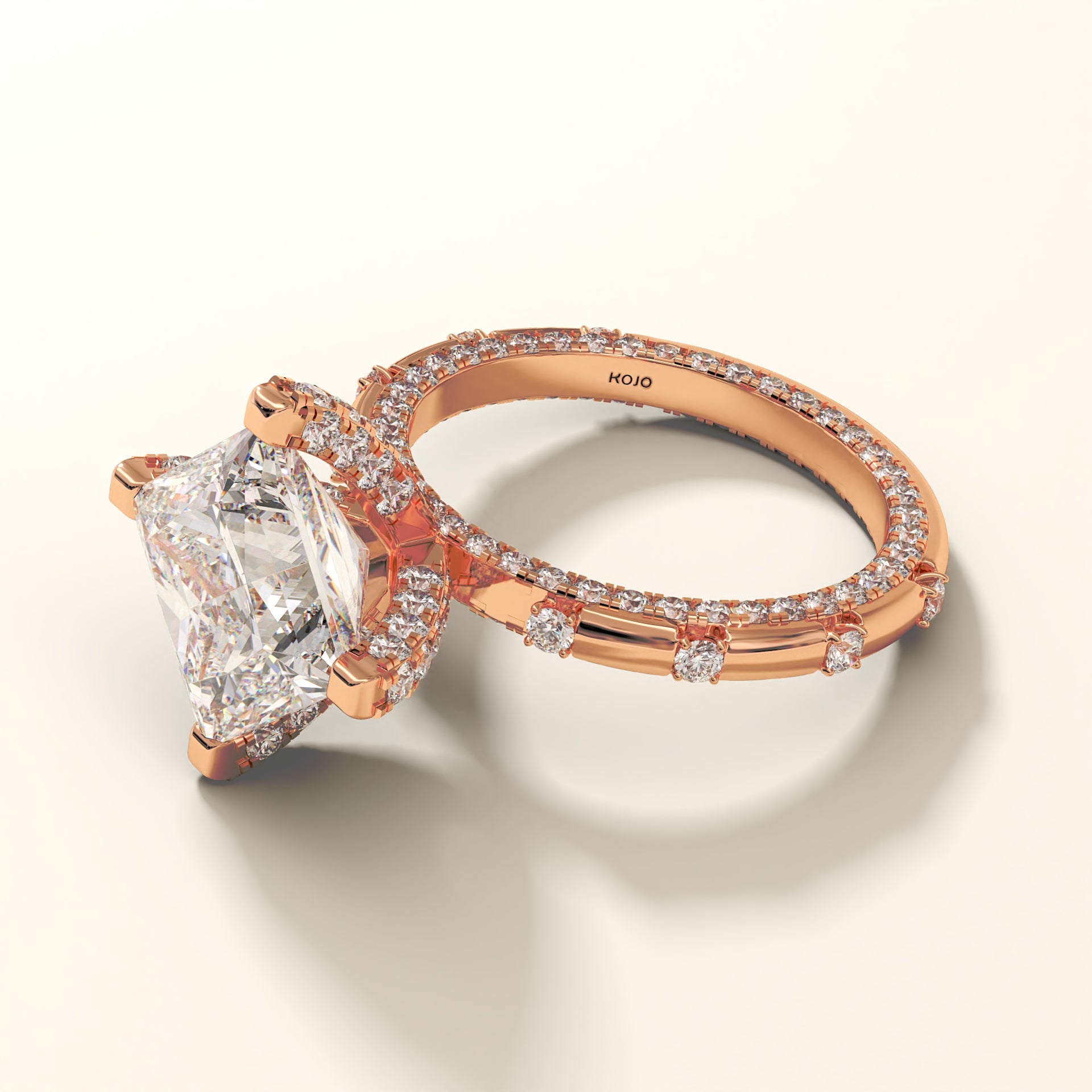 Rose gold Princess-cut with round lab diamonds ring in 18kt gold on a light background PERSPECTIVE-VIEW