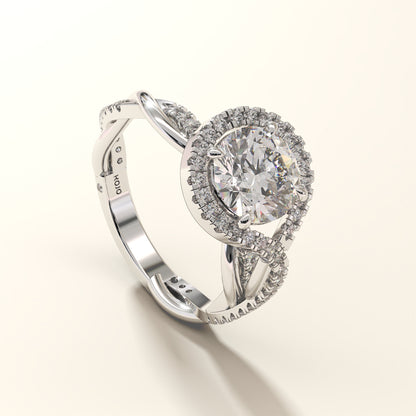 A 2CT round-cut halo twist diamond ring in white gold, with a twisted shank.
