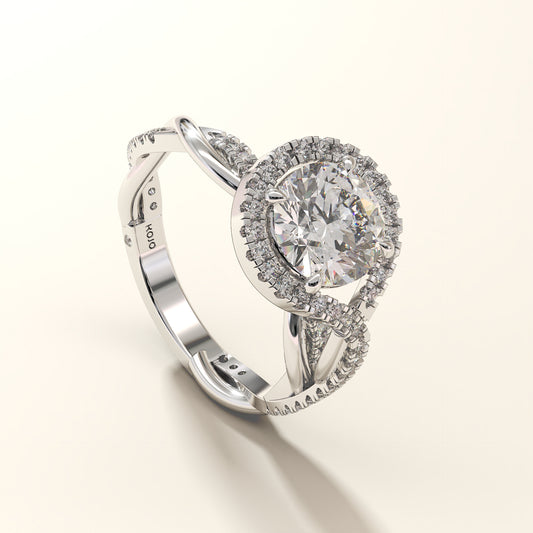A 2CT round-cut halo twist diamond ring in white gold, with a twisted shank.