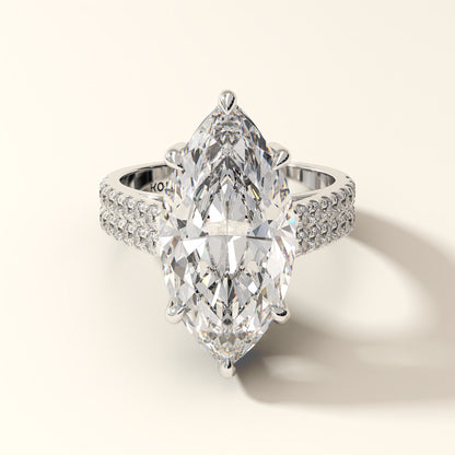 Marquise-cut diamond engagement ring with double pavé band in 18K white gold.