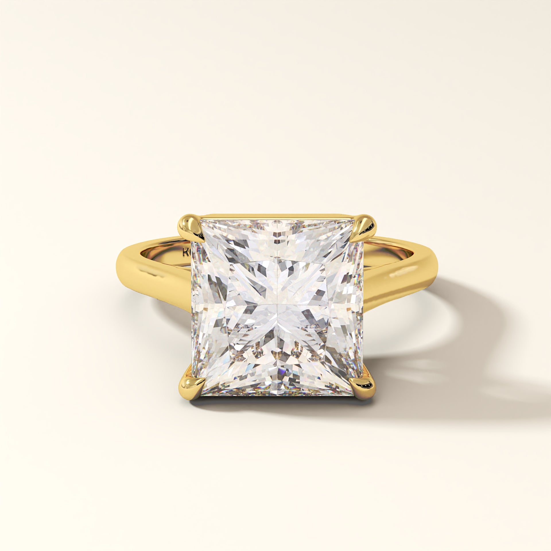 princess-cut diamond ring in yellow gold showing floating solitaire setting.