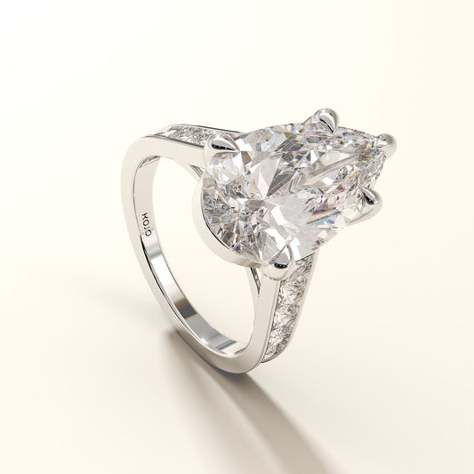 Celestial Verge side view of pear cut lab grown diamond ring with pave band in white gold