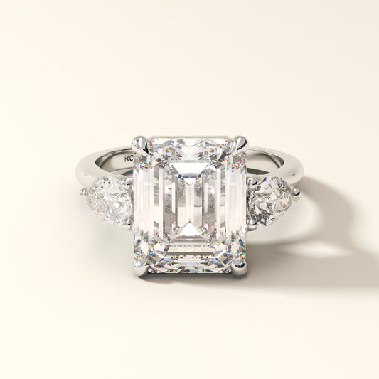 Celestine Verge emerald cut lab grown diamond three stone ring with pear side stones