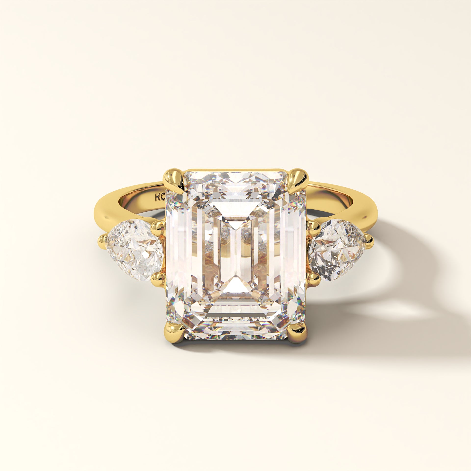 Celestine Verge emerald cut three stone lab grown diamond ring in yellow gold