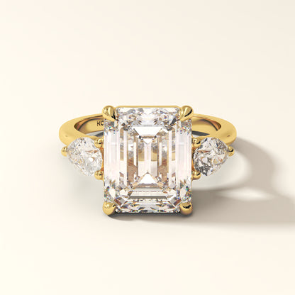 Celestine Verge emerald cut three stone lab grown diamond ring in yellow gold